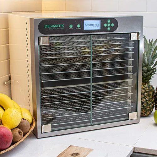 Deshidratador Desimatix DH12B+ sobre la mesada de una cocina, rodeado de frutas frescas